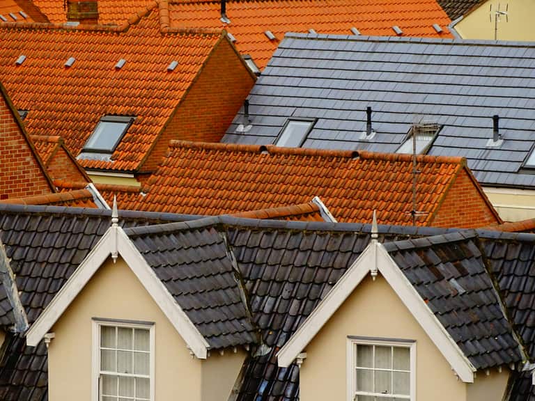 Tiled and slate rooftops of homes in a Somerset town